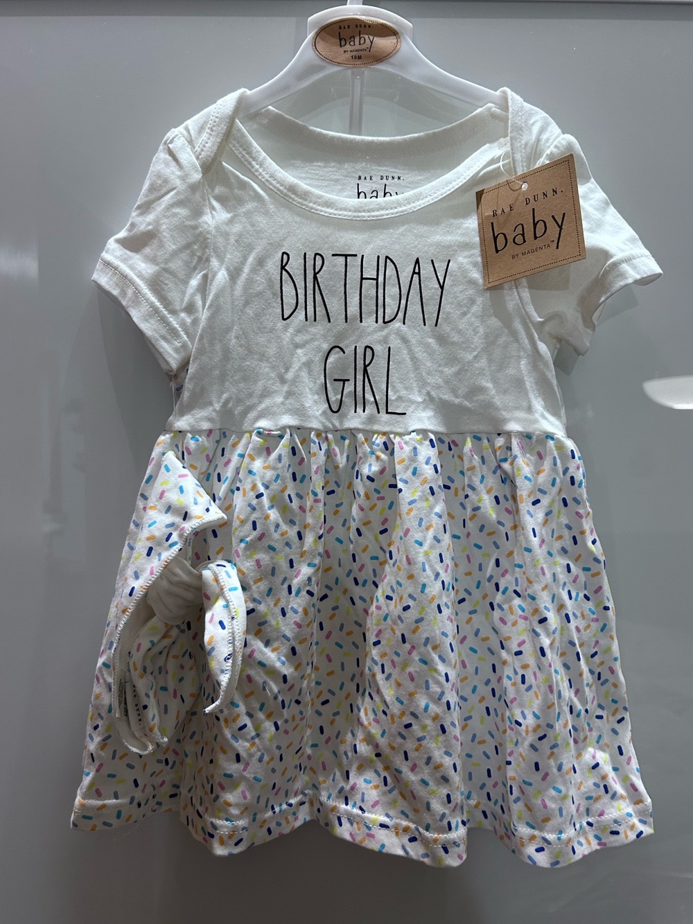 Rae Dunn Birthday Girl  
Baby Dress with Multicolor Sprinkles